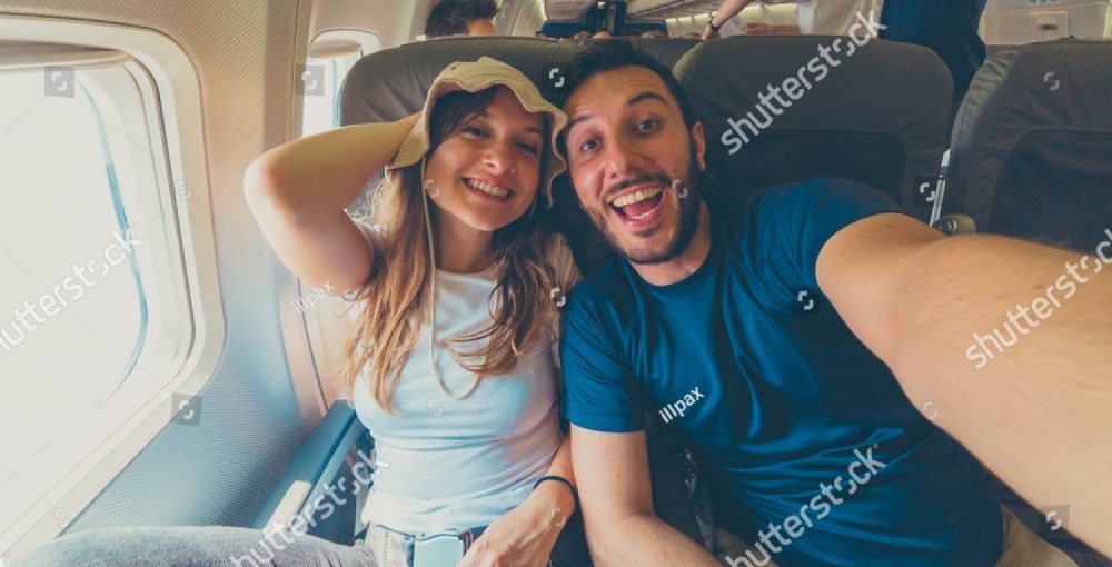Stock Photo Happy Crazy Cool Couple Friends In The Airplane Cabin